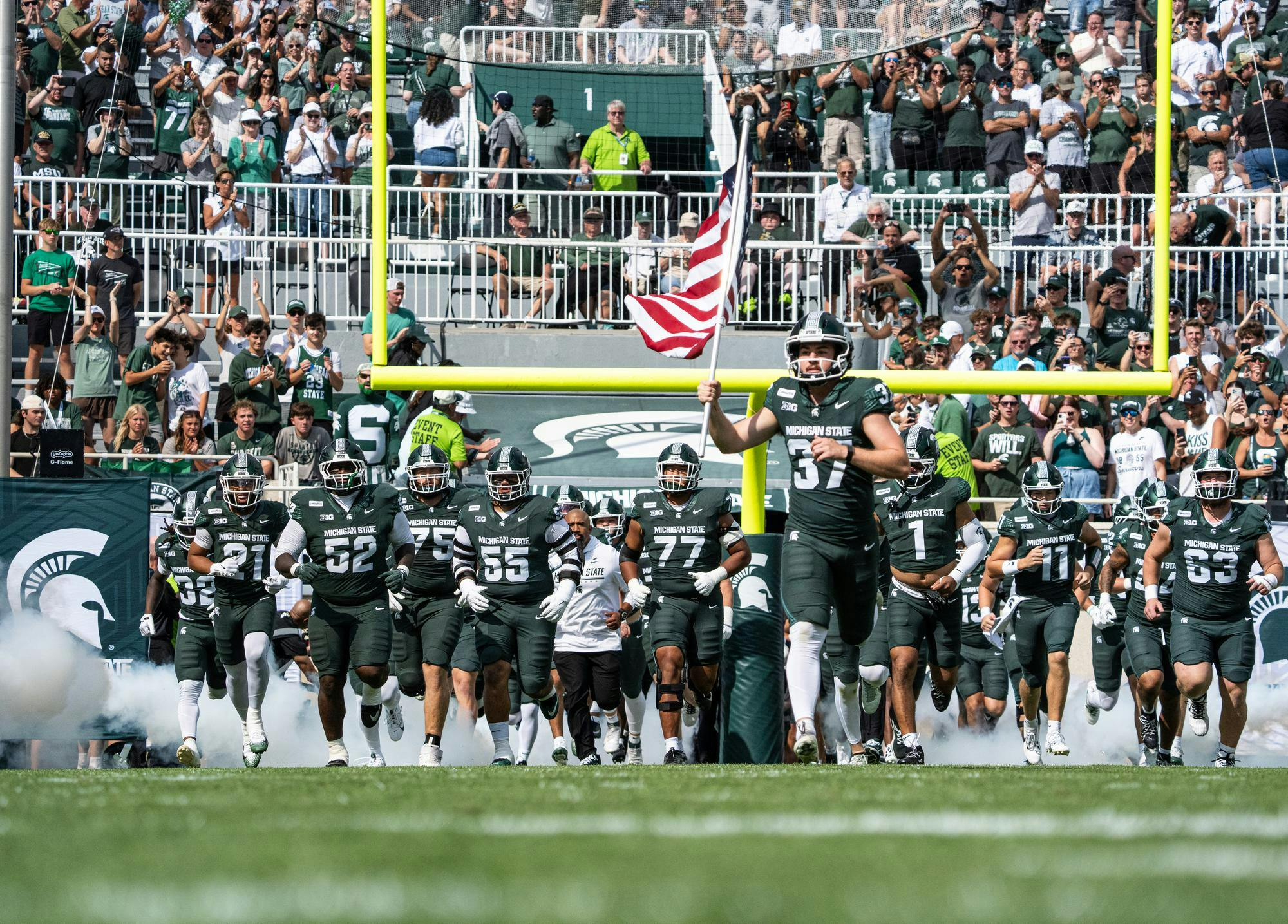 <p>Michigan State football players run onto the field at Spartan Stadium in East Lansing, Mich., on Sept. 12, 2026.</p>