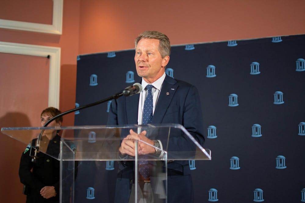 <p>UNC Chancellor Kevin Guskiewicz speaks at a press conference in Gerrard Hall on Wednesday, Sept. 12, 2023 regarding an incident involving an armed individual at Alpine Bagel Cafe. Image taken by Samantha Lewis and provided by The Daily Tar Heel.</p>