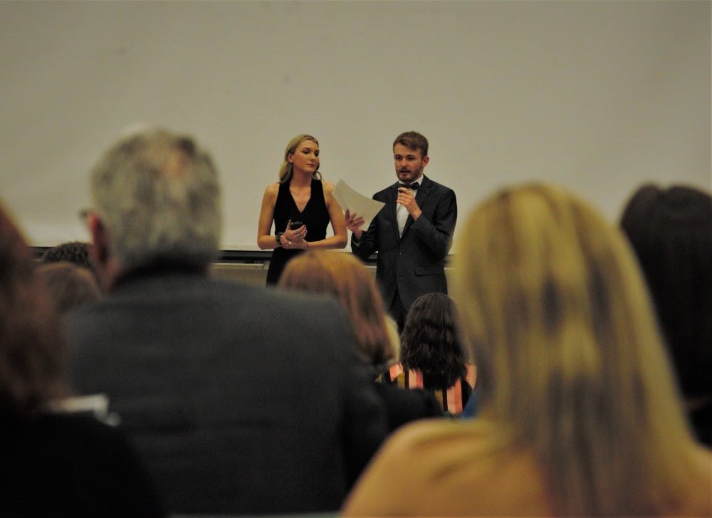 <p>Event Planner and premiere host, Kathleen Blakemore (left) and Director Bradley Coster (right) introducing the student film, &quot;Dead Ends&quot; at Well&#x27;s Hall on April 12, 2019</p>