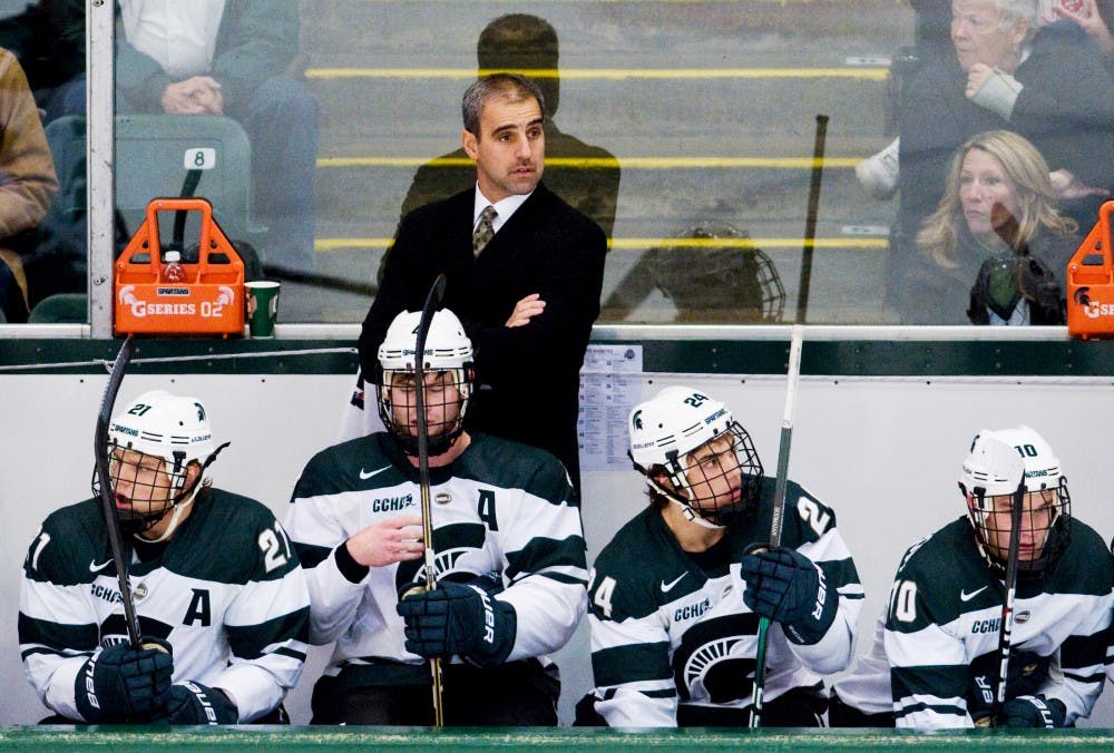 Head coach Tom Anastos looks out at the ice at Munn Ice Arena in this In this Oct. 21, 2012 photo. State News File Photo