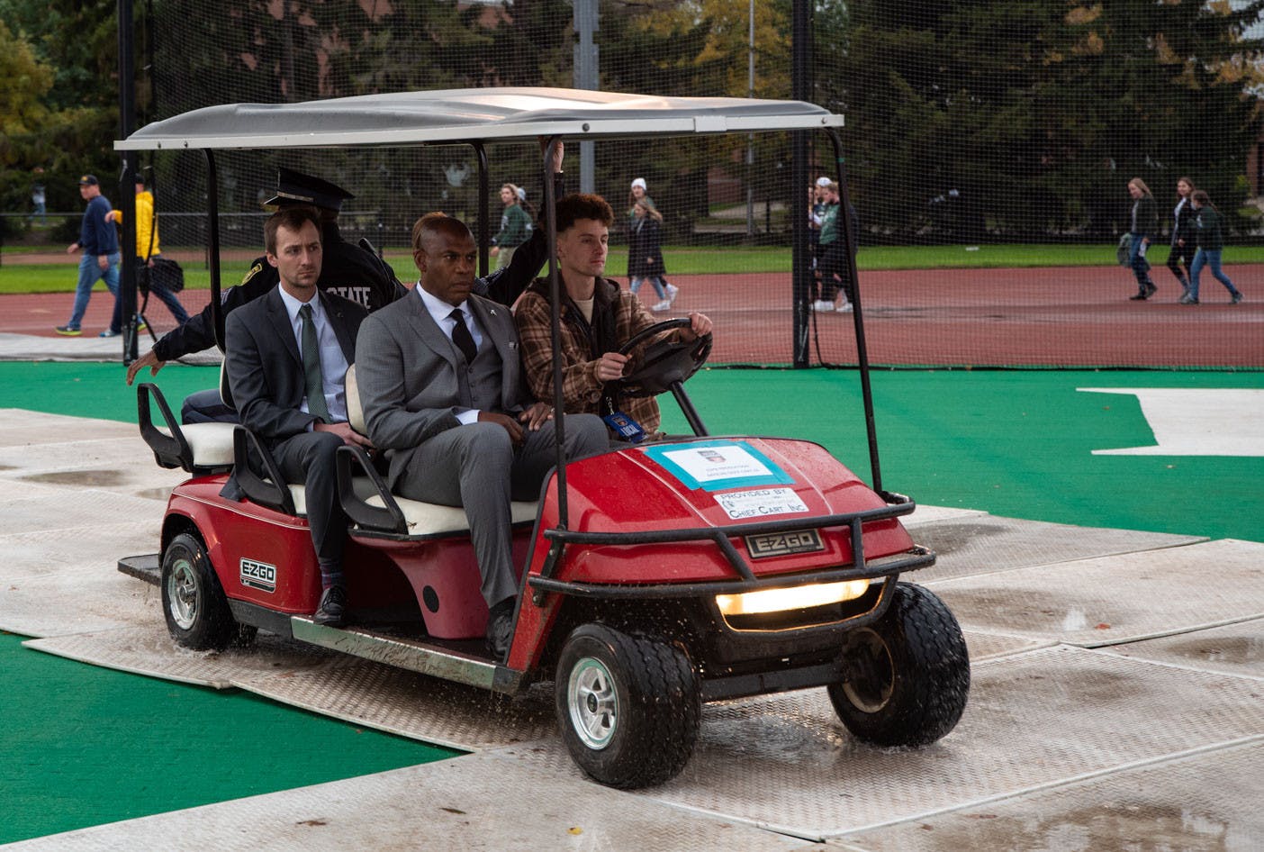 <p>Football head coach Mel Tucker arrives at the broadcast via golf cart and was scheduled to speak live at 9:20 a.m. Michigan State and Michigan fans gathered with signs for the broadcast of ESPN&#x27;s College GameDay, which took place at Ralph Young Field at 9 a.m. Shot on Oct. 30, 2021. </p>