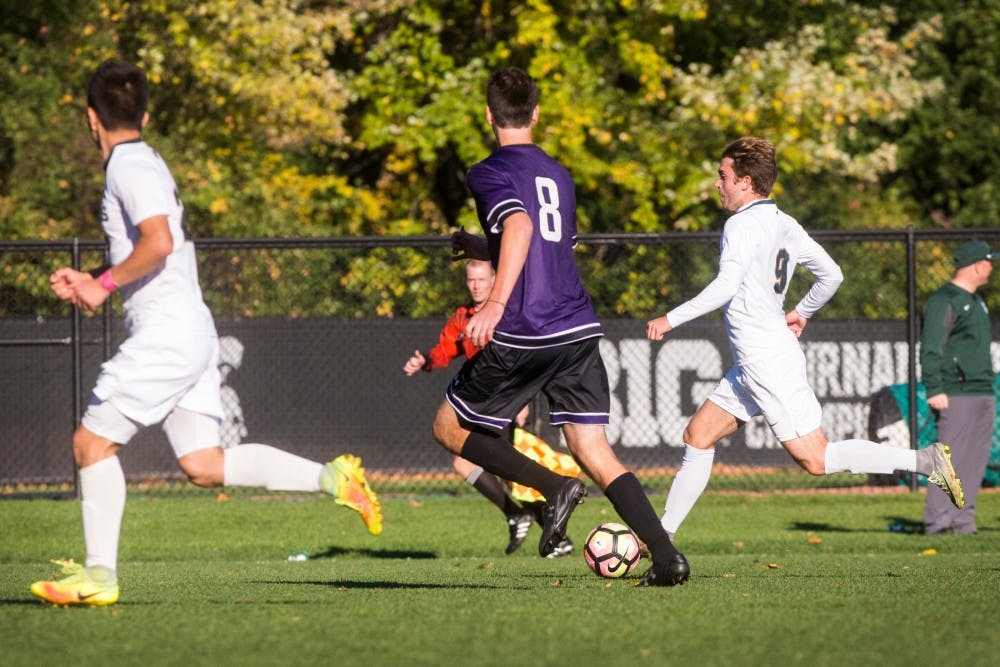 Junior midfielder Michael Marcantognini (9) dribbles the ball up the field during the game against Northwestern on Oct. 22, 2016 at DeMartin Stadium at Old College Field. The Spartans defeated the Wildcats, 2-1.
