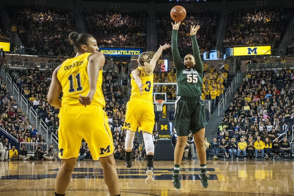 Junior forward Kennedy Johnson (55) shoots over Michigan guard Katelynn Flaherty (3) during the women's basketball game against the University of Michigan on Feb. 19, 2017 at Crisler Arena in Ann Arbor, Mich. The Spartans defeated the Wolverines, 86-68.