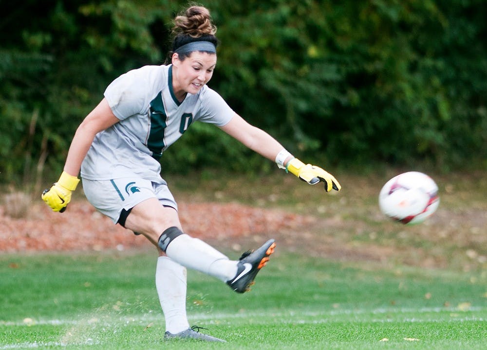 	<p>Junior goalkeeper Courtney Clem kicks the ball back into play during the game against Wisconsin, Sept. 29, 2013, at DeMartin Stadium at Old College Field. <span class="caps">MSU</span> lost to Wisconsin, 2-0. Danyelle Morrow/The State News</p>