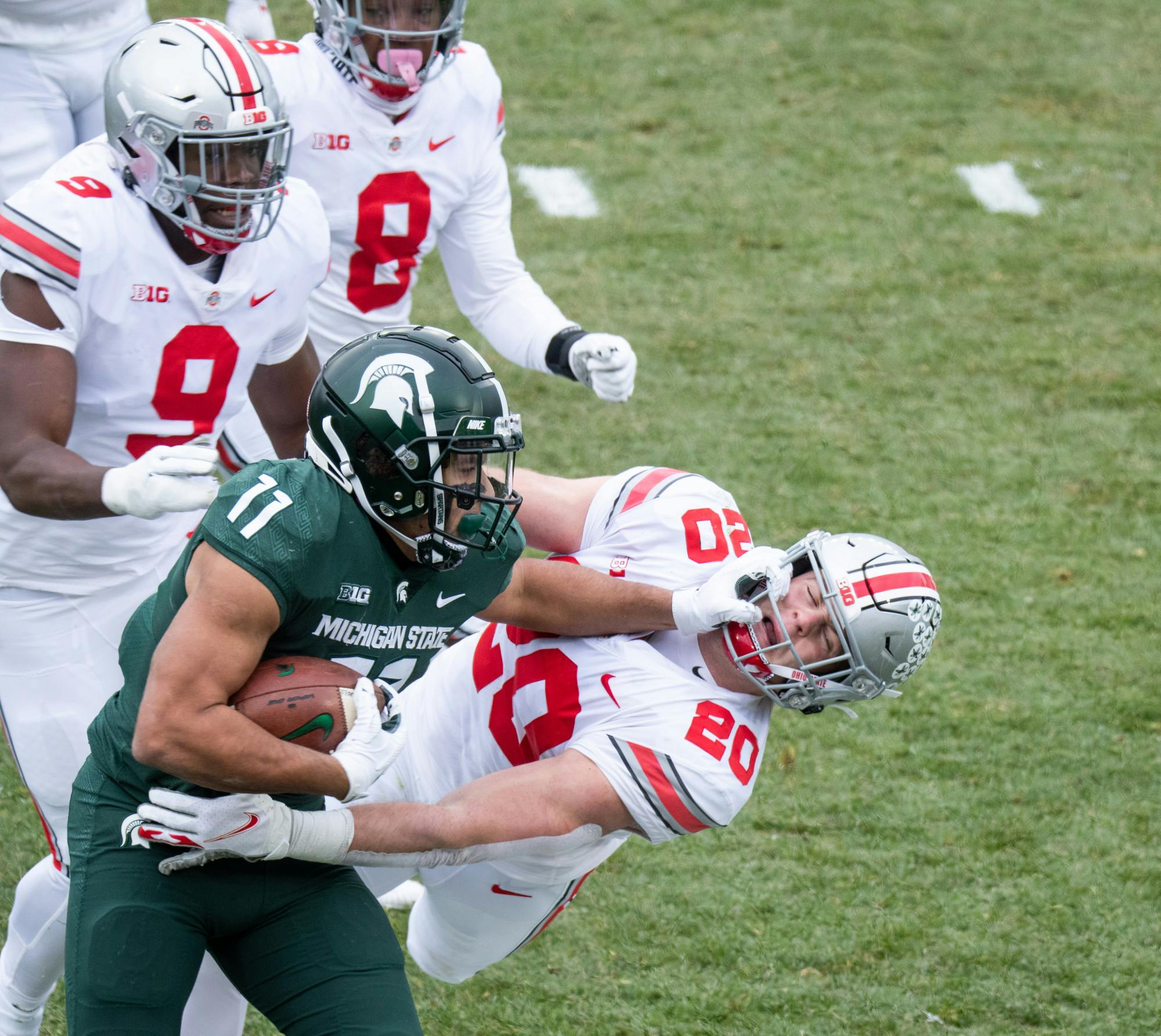 MSU runningback, Connor Heyward (11), carries the ball for Michigan State in a game against OSU in Spartan Stadium on Dec. 5, 2020.