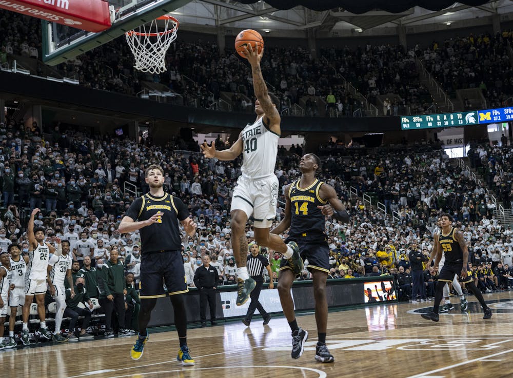 <p>Spartan wide receiver Keon Coleman stepped off the field and onto the court for the first time during MSU’s game against the University of Michigan on Saturday, Jan. 29, 2022. He scored MSU’s final points of the game.</p>
