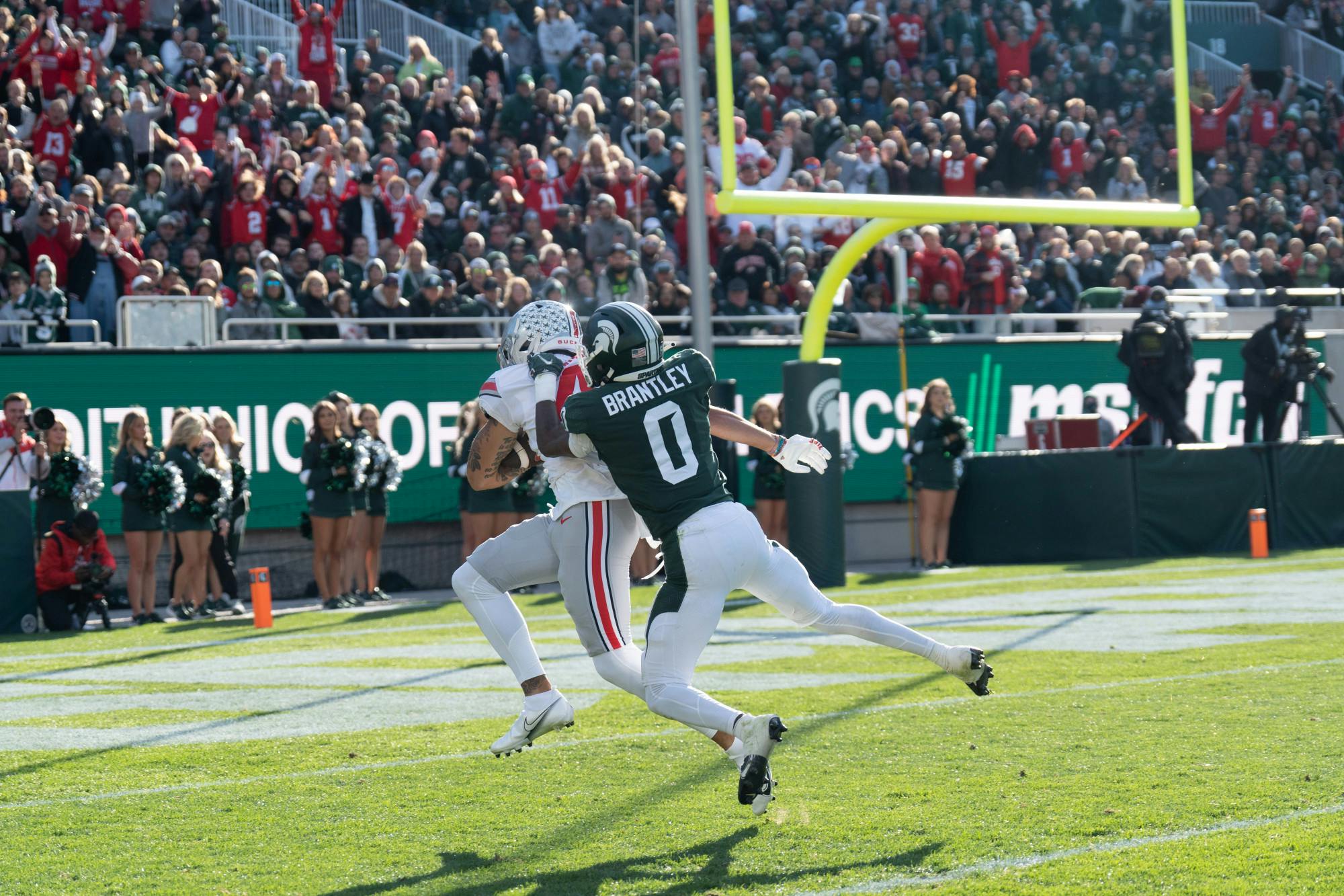 <p>Sophomore cornerback Charles Brantley, 0, tackles his Buckeye opponent during the match on Oct. 8, 2022.﻿</p>