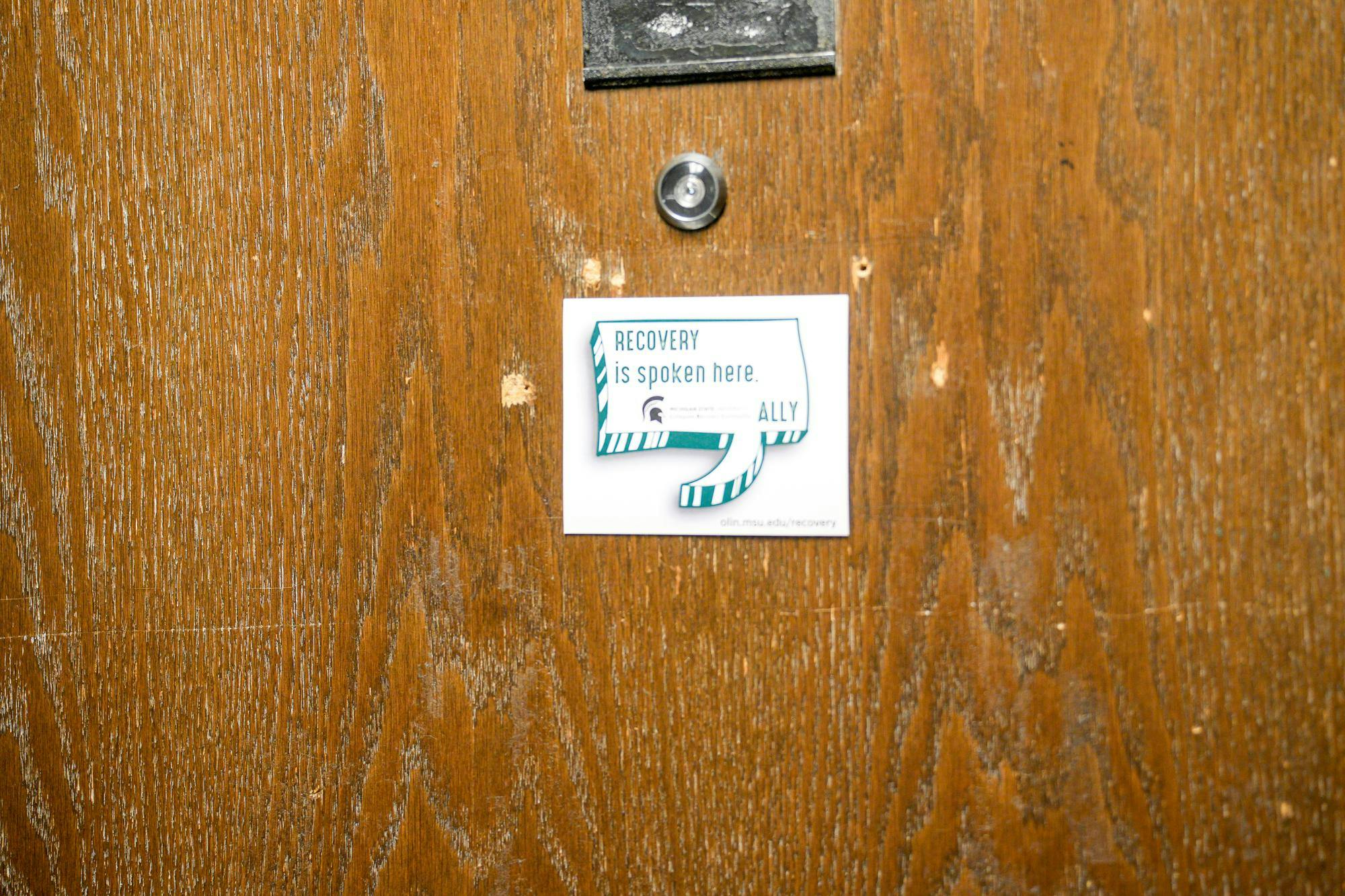 “Recovery is spoken here,” sign posted on a door on the second floor of Mason Hall taken on Sept. 8, 2023. 