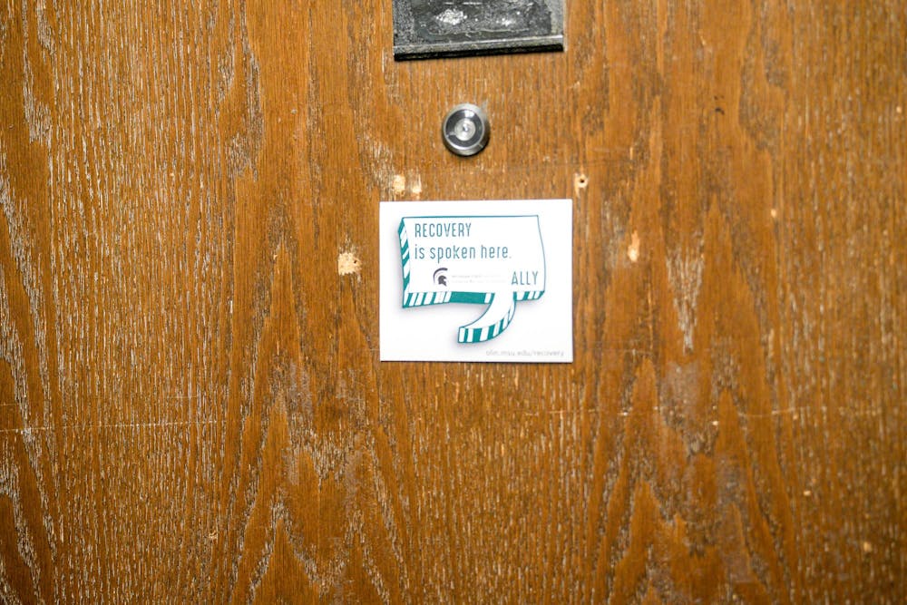 “Recovery is spoken here,” sign posted on a door on the second floor of Mason Hall taken on Sept. 8, 2023. 