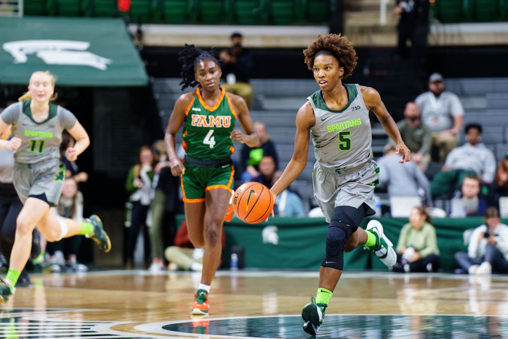 <p>Graduate student guard Kamaria McDaniel (5) runs with the ball during a matchup against Florida A&amp;M at the Breslin Center on Nov. 17, 2022. The Spartans defeated the Rattlers 109-44.</p>
