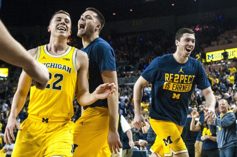 Michigan's basketball team reacts as they head into the locker room after the first half of the men's basketball game against the University of Michigan on Feb. 7, 2017 at Crisler Arena in Ann Arbor, Mich. The Spartans were defeated by the Wolverines, 86-57.  
