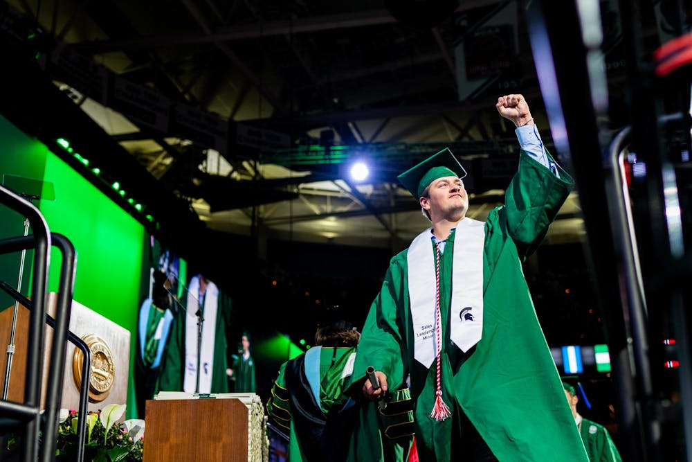 Student receives diploma during the Michigan State University College of Communication Arts and Sciences graduation ceremony at the Breslin Student Events Center on Michigan State University’s campus in East Lansing, Mich., on Friday, May 1, 2026.