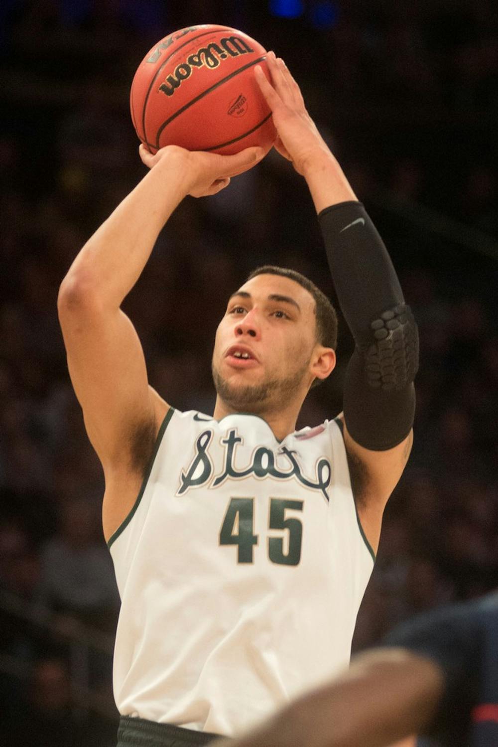 <p>Sophomore guard Denzel Valentine shoots during the game against Connecticut on March 30, 2014, at Madison Square Garden in New York City. The Spartans lost in the Elite Eight, 60-54. Julia Nagy/The State News</p>