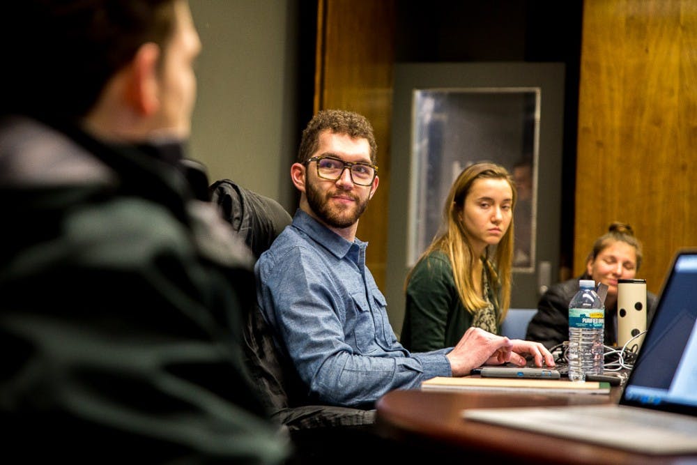 Social relations and policy senior Colin Wiebrecht listens to a committee member speak during an ASMSU meeting on Jan. 24, 2019, at the Student Services Building.