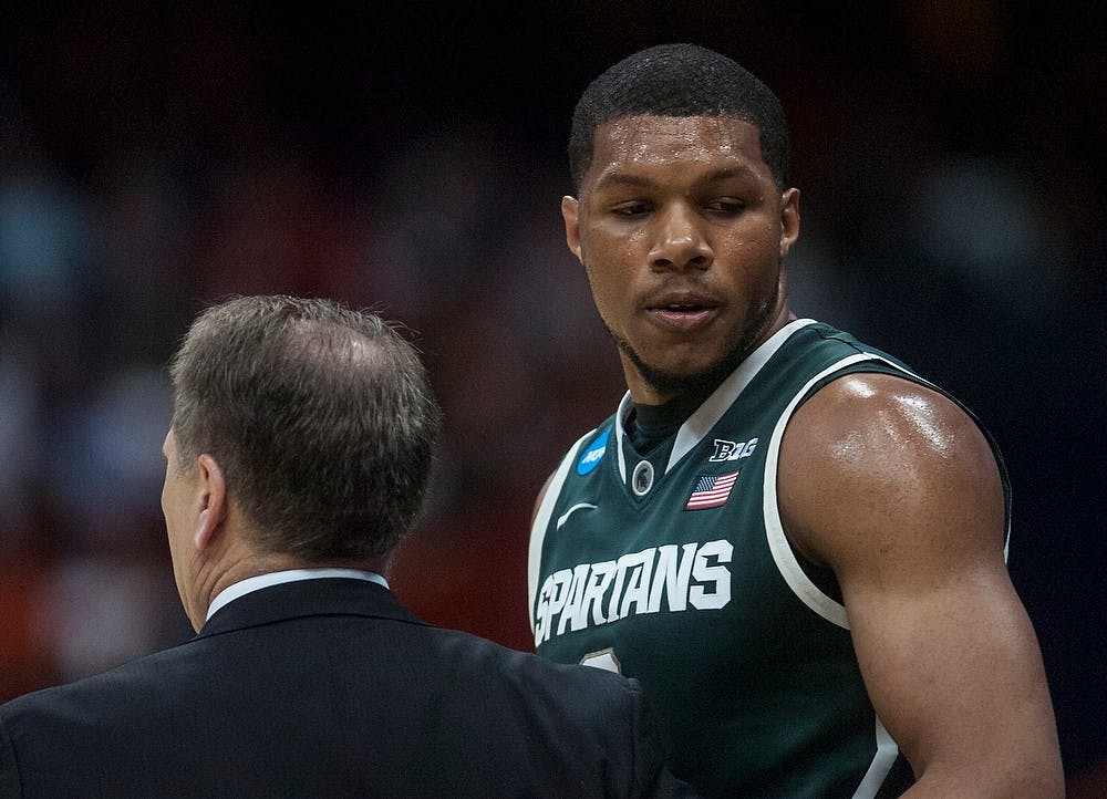 <p>Freshman forward Marvin Clark Jr. heads to the bench after talking to head coach Tom Izzo March 27, 2015, during the East Regional round of the NCAA Tournament in a game against Oklahoma at the Carrier Dome in Syracuse, New York. The Spartans the Sooners, 62-58. Erin Hampton/The State News</p>