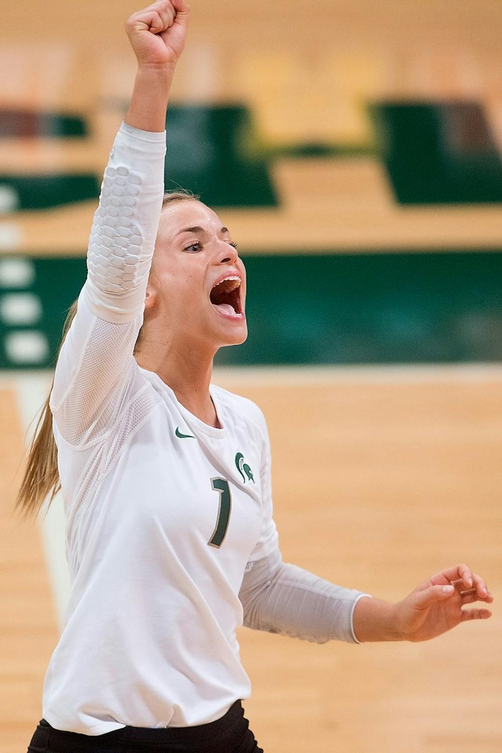 <p>Senior libero Kori Moster cheers after a Spartan point during the game against LIU Brooklyn on Sept. 19, 2014, at Jenison Field House. The Spartans lost, 3-2. Julia Nagy/The State News</p>