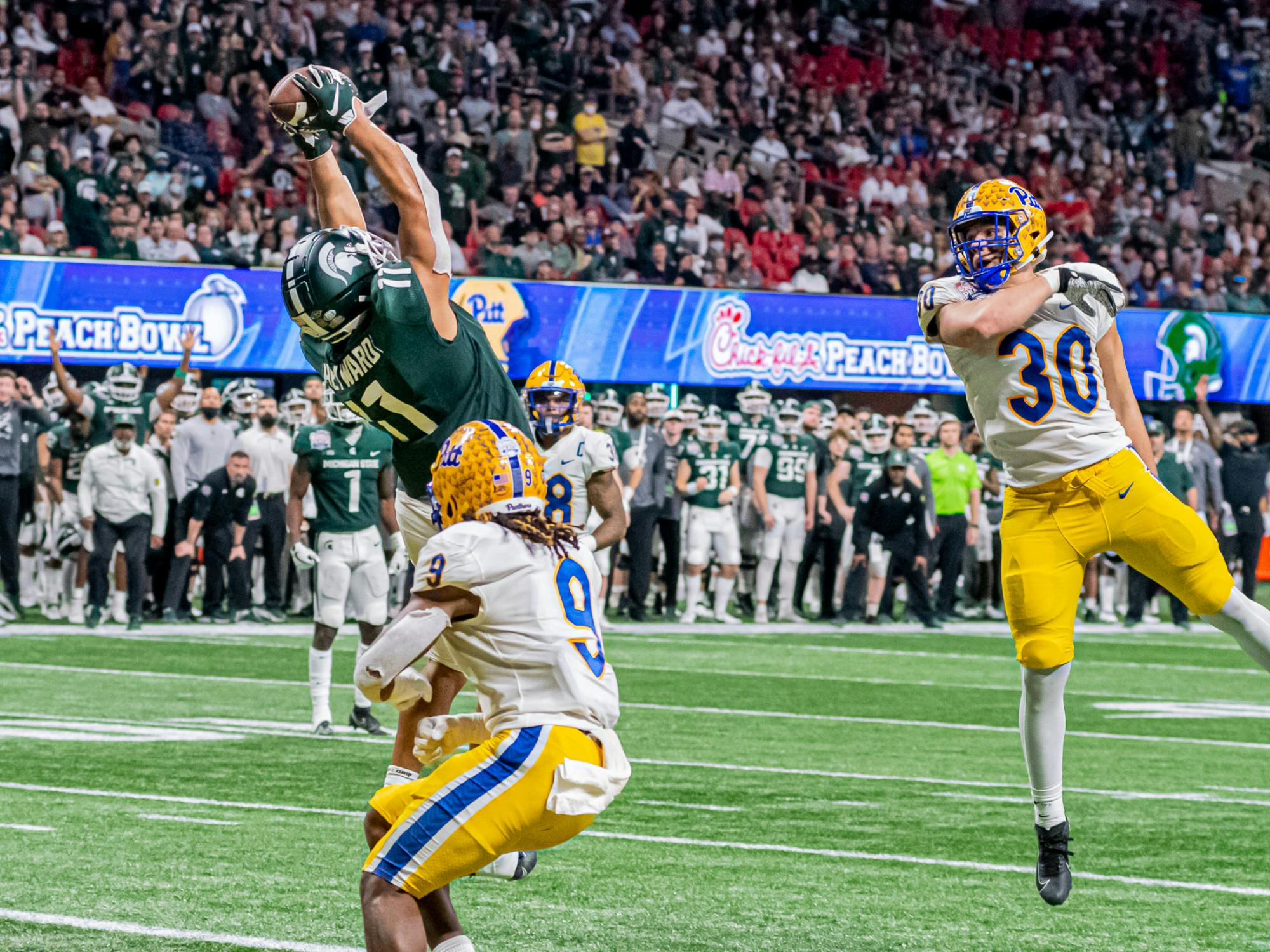 <p>Redshirt senior tight end Connor Hayward hauls in a touchdown midway through the fourth quarter during the Spartans 31-21 victory against Pitt in the Chick-Fil-A Peach Bowl on Dec. 30, 2021.</p>