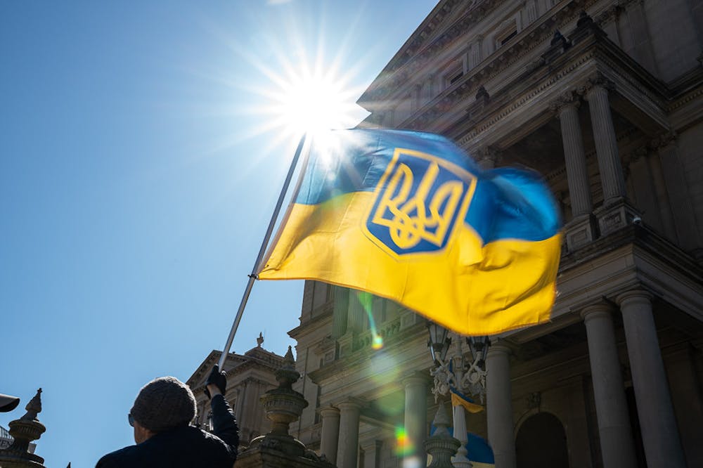 <p>A Ukrainian flag is held high at the Michigan State Capitol on March 20, 2022, where a rally in support of Ukraine was held. Members of Lansing&#x27;s Ukrainian community gathered in support of Ukrainian President Zelensky&#x27;s request to close the Ukrainian sky and to open the border&#x27;s for the homeless looking for refuge.</p>
