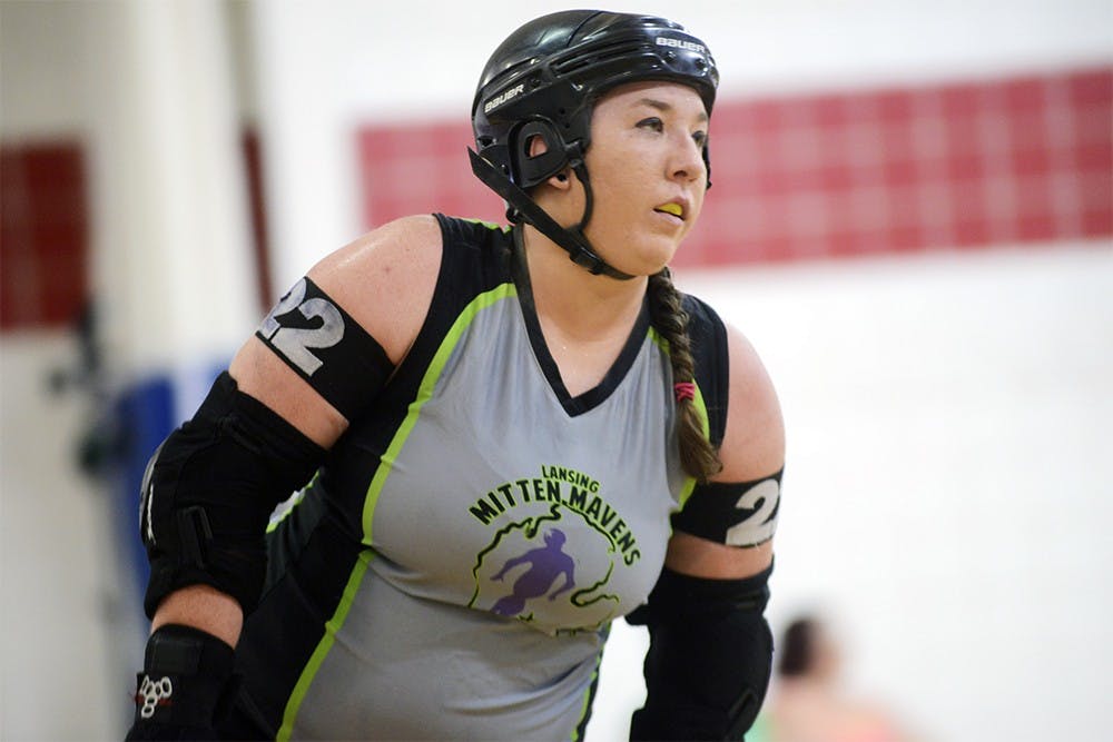 <p>Ali Jahr, who goes by "Jahrmageddon"  for the Lansing Mitten Mavens Roller Derby team, competes in a match against the Bath City Roller Girls on June 20th, 2015 at Court One Training Center in East Lansing. Jahr graduated from MSU in social work this past year and has been playing for the team for four years. Wyatt Giangrande/The State News</p>