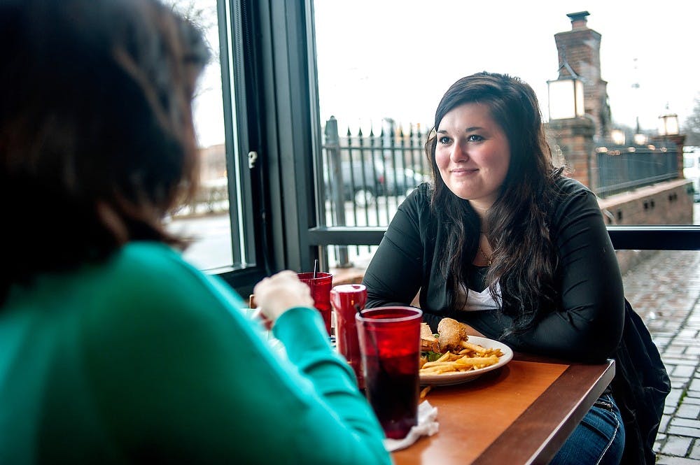 	<p>Criminal justice junior Jordan Ascione, right, catches up with Grand Ledge resident Marydawn Sullivan Tuesday, Jan 29, 2013, during lunch at Harrison Roadhouse, 720 Michigan Ave. Harrison Roadhouse is one of the restaurants and bars in the Beer Hound Membership Card program, a loyalty card system that works mostly in Michigan. Justin Wan/The State News</p>