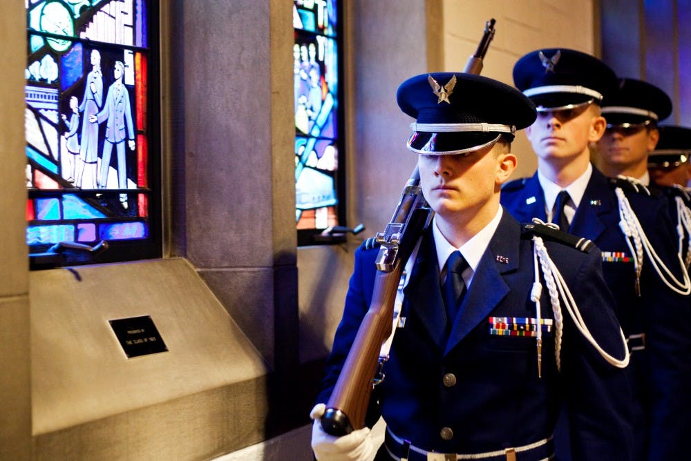 Cadet First Lieutenant Ryan Bachelor leads the Silver Eagles Drill Team to the back of Alumni Chapel Thursday afternoon at a prayer service for fallen veterans hosted by the MSU Air Force  ROTC. The Air Force ROTC met at Alumni Chapel before marching to the Administration Building to honor those who have given their lives defense of the United States. Matt Hallowell/The State News