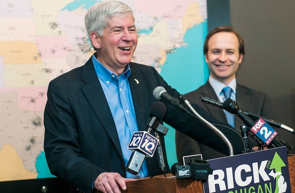 	<p>Gov. Snyder laughs with Lt. Gov. Brian Calley during his re-election kick-off speech Feb. 3, 2014, at Two Men And A Truck, 3400 Belle Chase Way, in Lansing. Two Men And A Truck is &#8220;a great success story about entrepreneurship in Michigan,&#8221; Snyder said during his speech. Erin Hampton/The State News</p>
