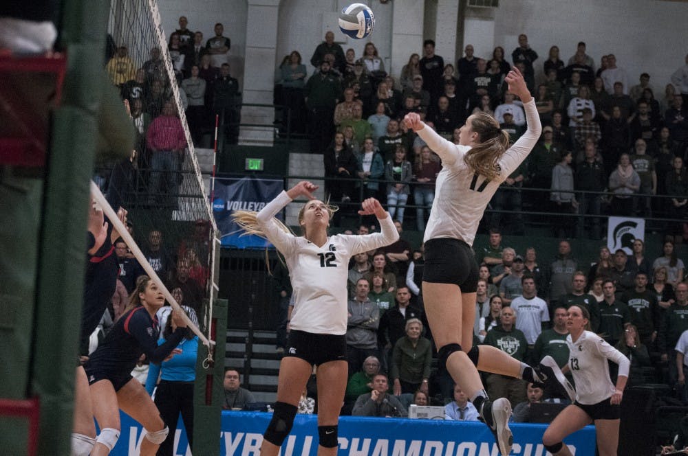 Junior middle blocker Alyssa Garvelink (17) prepares to spike the ball during the game against Arizona on Dec. 3, 2016 at Jenison Field House.  The Spartans were defeated by the Wildcats, 3-2.