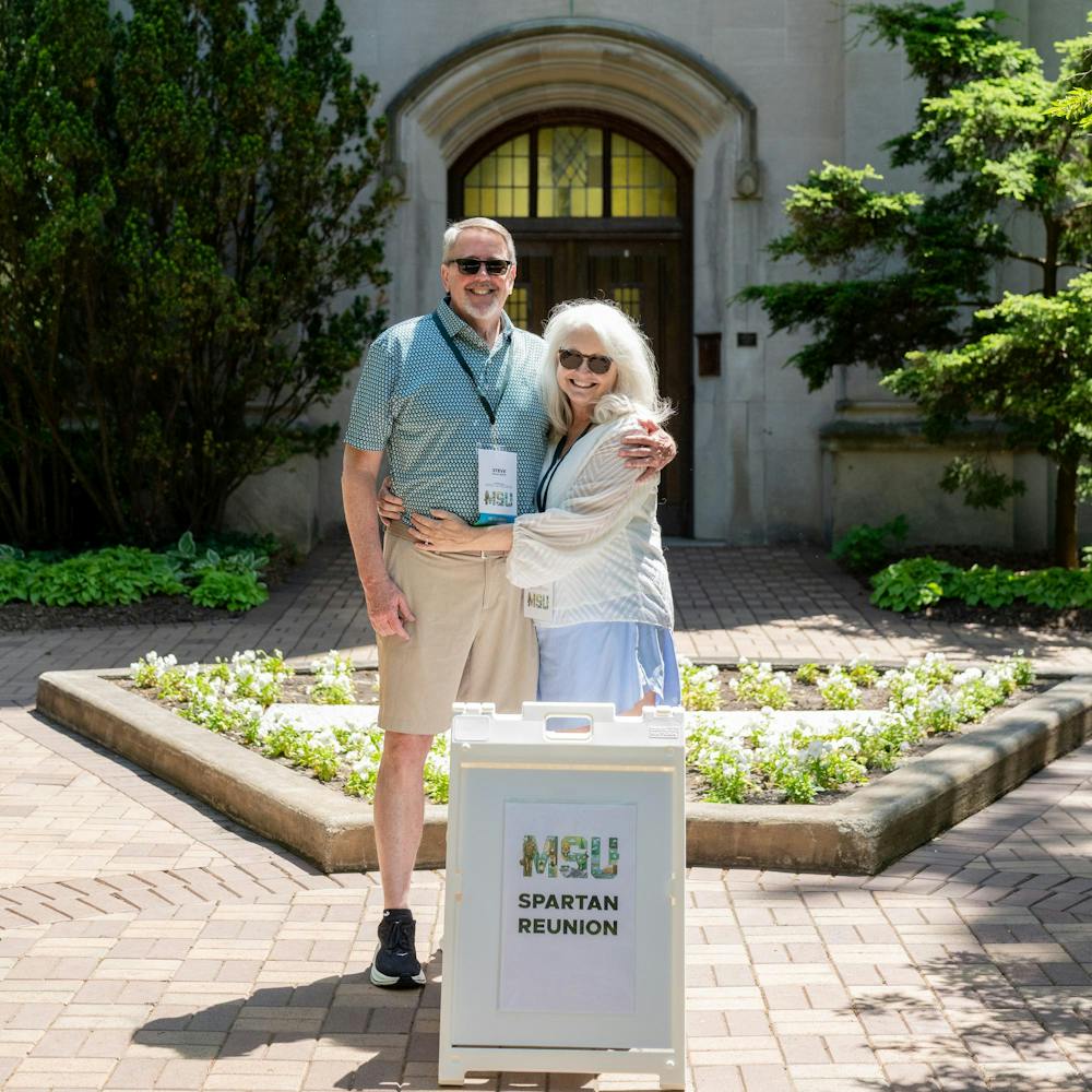 <p>Michigan State University alum, Steve Aldrich and his wife Anne, pose for a portrait in front of Beaumont Tower during their reunion in East Lansing, Mich., on May 28, 2026.</p>