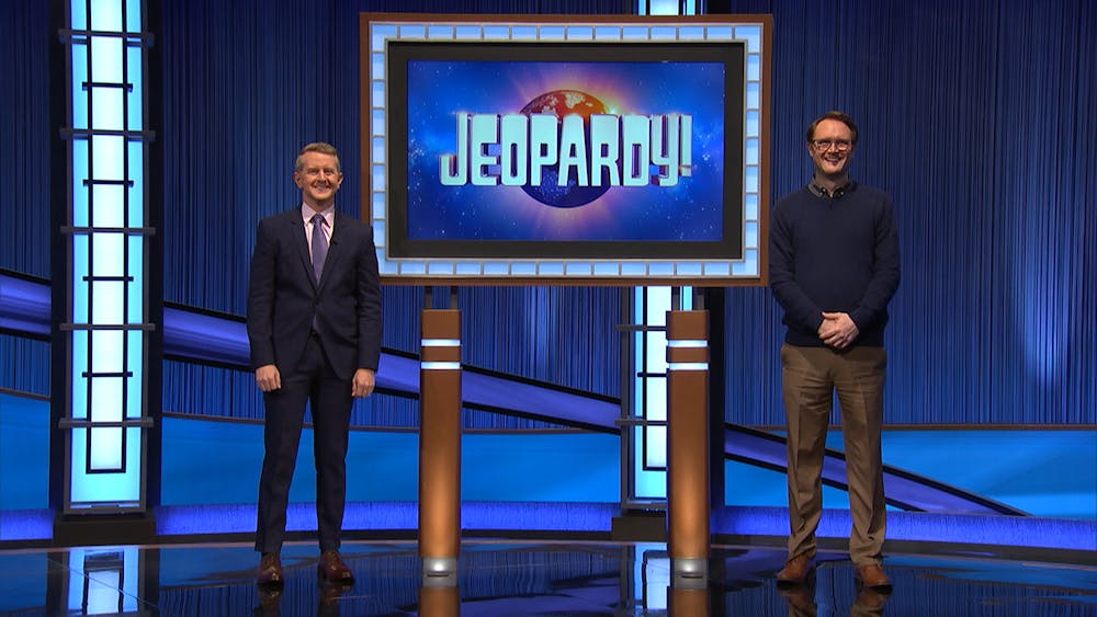 <p>Standing on the set of Jeopardy! former editor-in-chief of The State News David Miller poses with acting host Ken Jennings. The episode with Miller as a contestant was taped on Oct. 5 and aired on Dec. 1. </p>