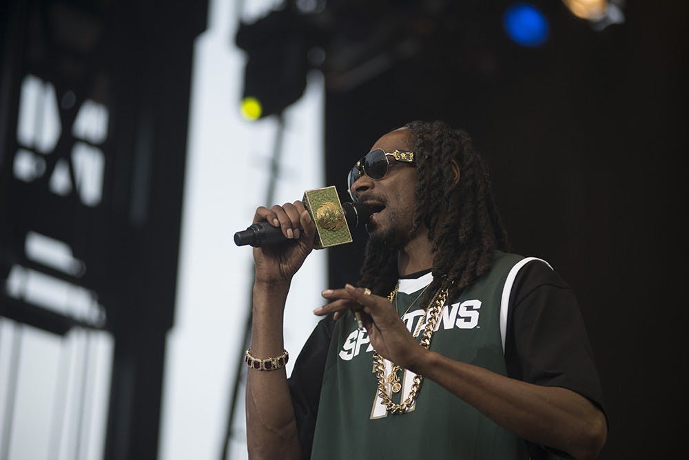 <p>Featured artist Snoop Dogg performs at the Common Ground Music Festival in Lansing July 11, 2015 right before leaving for a tour of Europe for his new album, "Bush." Catherine Ferland/ The State News</p>