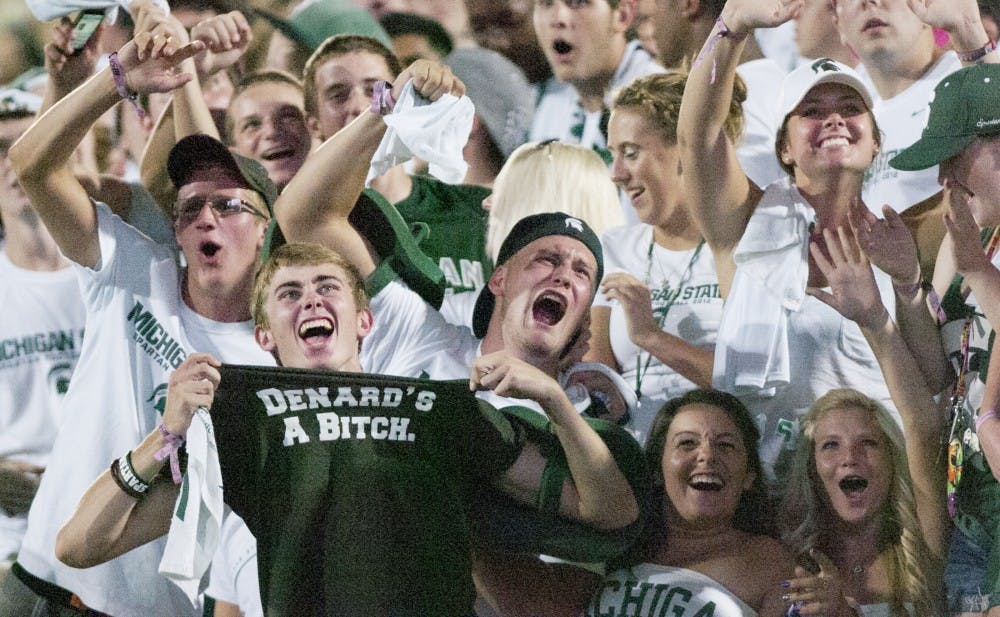Fans cheer after noticing they are on the big screen Friday night at Spartan Stadium. MSU defeated Boise State 17-13 in the home opener. Matt Hallowell/The State News
