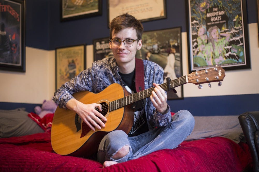 Grand Ledge resident Austin Gullett poses for a portrait on Jan. 25, 2017 at his home in Grand Ledge. Gullet is the coordinator for a musical charity group known as The Radish and Friends.