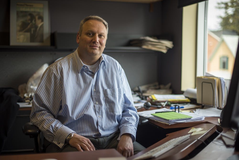 The State News Newsroom Adviser Omar Sofradzija poses for a portrait on April 11, 2018 in his office at The State News.