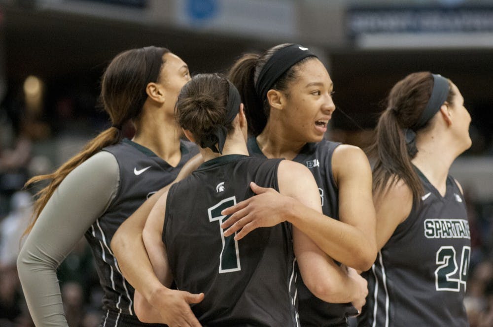 Junior forward Aerial Powers embraces junior guard Tori Jankoska during the women's basketball Big Ten Tournament semifinals game against Ohio State University on March 5, 2016 at Bankers Life Fieldhouse in Indianapolis. The Spartans defeated the Buckeyes, 82-63