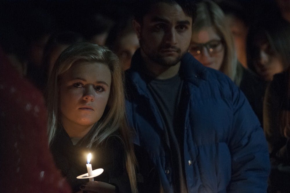 Hundreds of friends and family members gather together for a candlelight vigil on Nov. 29, 2016 at The Rock to mourn the passing of former student Abhi Shah. 