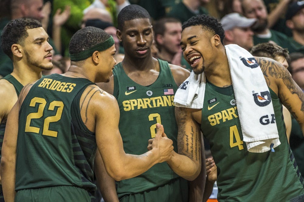 Sophomore guard Miles Bridges (22) and sophomore forward Nick Ward (44) share a moment during the men's basketball game against Maryland on Jan. 4, 2018 at Breslin Center. The Spartans defeated the Terrapins, 91-61. (Nic Antaya | The State News)