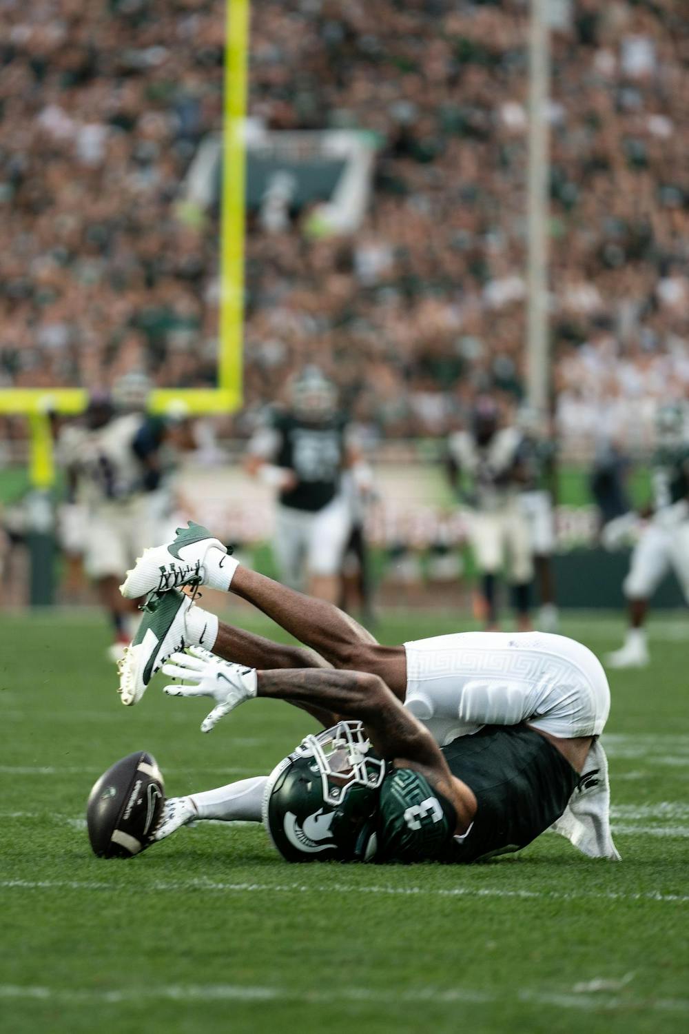 <p>Wide receiver Montorie Foster, Jr. (3) fumbles the ball while running down the field at Spartan Stadium on Aug. 30, 2024.</p>