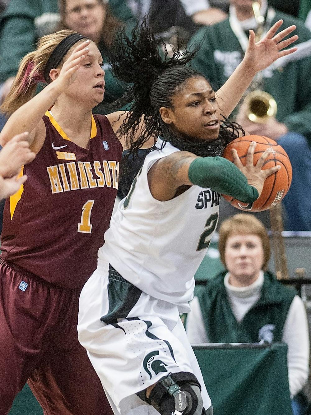 	<p>Redshirt freshman forward Akyah Taylor grabs a defensive rebound in the second half of the game in front of Minnesota guard Rachel Banham. The Spartans defeated the Gophers, 66-51, Thursday, Jan. 3, 2012, at Breslin Center. Justin Wan/The State News</p>