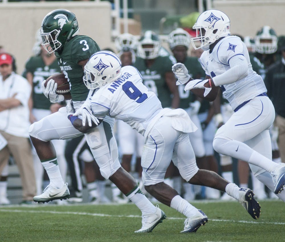 Sophomore running back LJ Scott breaks the tackle of Furman cornerback Aaquil Annoor during the home football game against Furman on Sept. 2, 2016 at Spartan Stadium.  Scott had 20 carries for 108 yards.