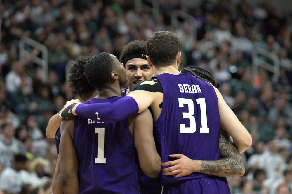 <p>The Northwestern Wildcats take a team huddle during the game against the Spartans at the Breslin Center on Dec. 4, 2022. ﻿</p>