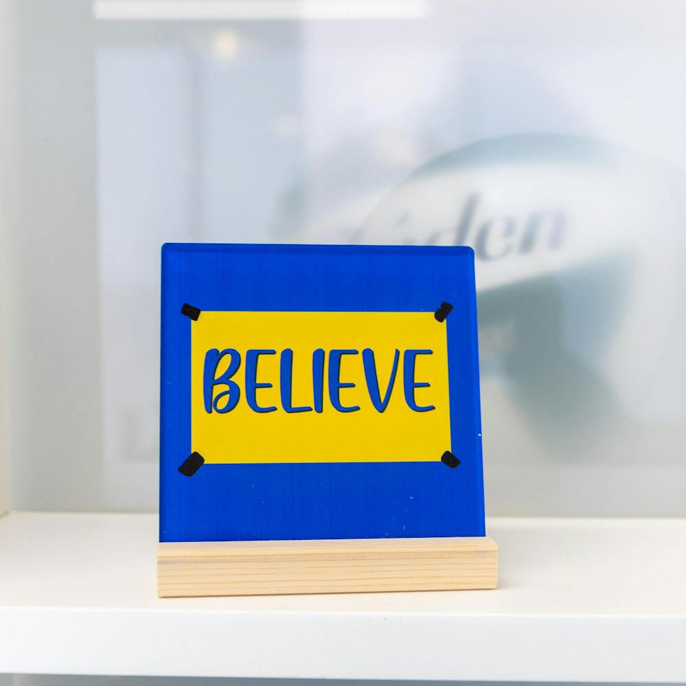 <p>A believe sign from the show "Ted Lasso" is on a shelf in Michigan State athletic director Dan Bartholomae's office in East Lansing, Mich., on Wednesday, Oct. 7. 2026.</p>