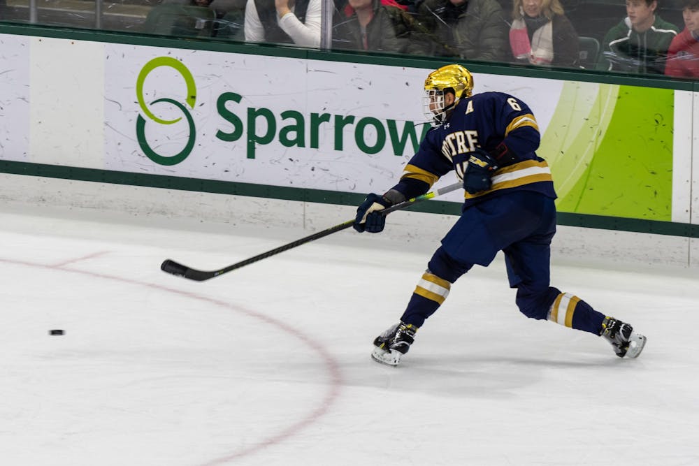 <p>Notre Dame defenseman Tory Dello shoots against Michigan State. The Spartans were defeated by the Fighting Irish, 2-1, at Munn Ice Arena on November 22, 2019. </p>