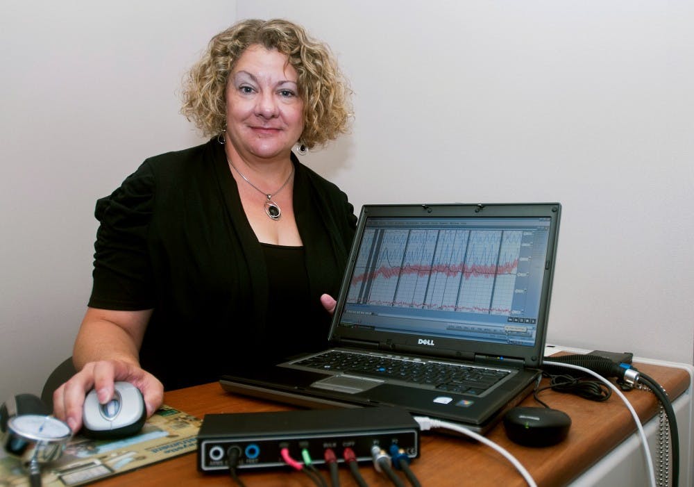 Detective Anne Stahl sits beside the polygraph instrument at MSU Police, 1120 Red Cedar Rd. on Wednesday, Aug. 8, 2012. Stahl conducts polygraph tests to tell whether or not people are being deceptive. Samantha Radecki/The State News