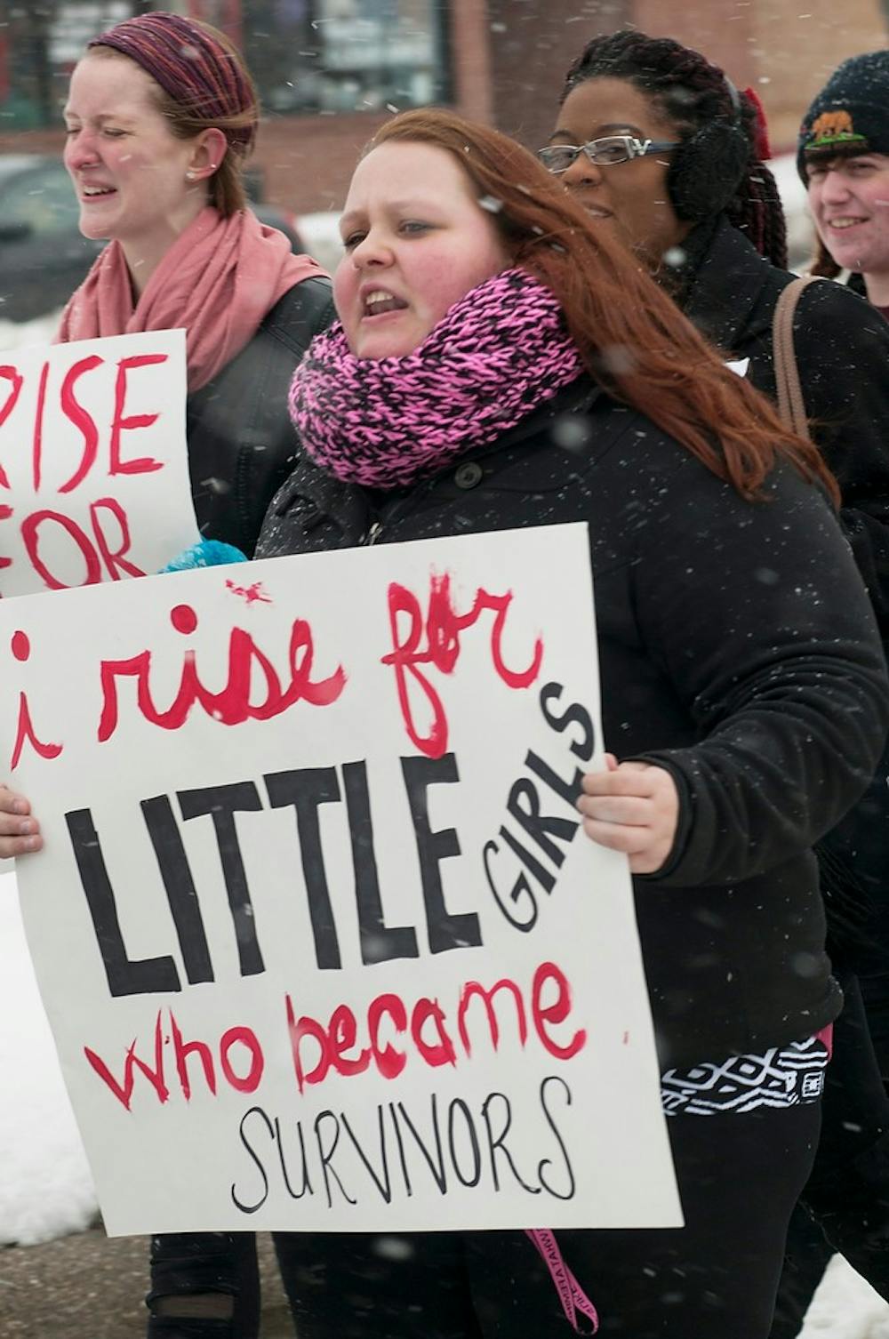 	<p>Arts and humanities senior and sexual assault survivor Janelle Moulding marches down Grand River ave. at the second annual V-Day March to End Violence to raise awareness of sexual assault on Friday. Marchers were comprised of survivors and supporters both male and female. Casey Hull/The State News</p>