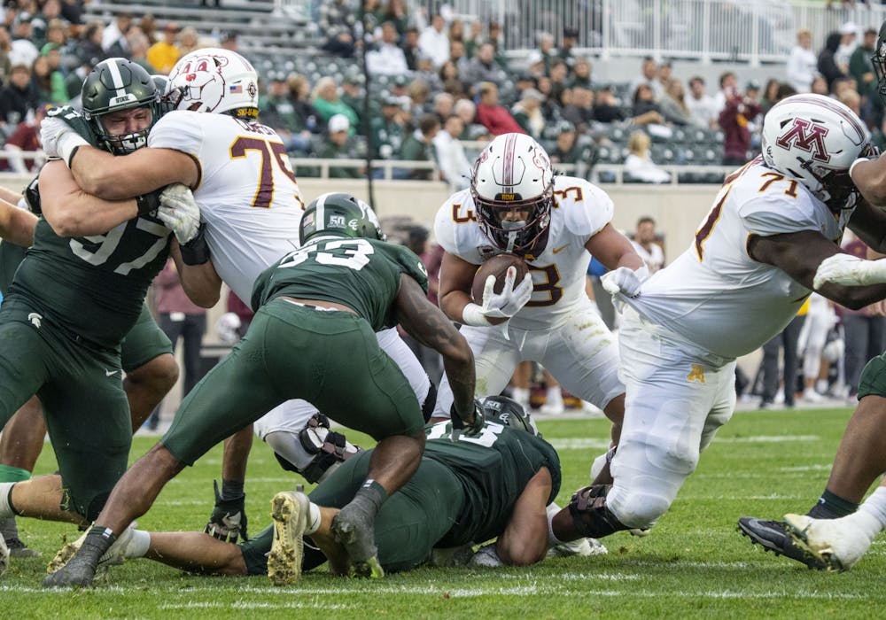 <p>Trey Potts, 3, attempts to push through the Michigan State defense during Minnesota’s match against the Spartans at Spartan Stadium on Saturday, Sept. 24, 2022. The Gophers ultimately beat the Spartans, 34-7.</p>