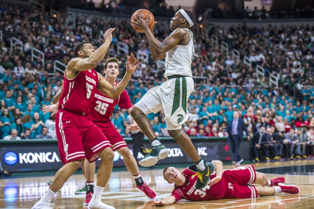 Sophomore guard Cassius Winston (5) goes for a lay up during the second half of the men's basketball game against Wisconsin on Jan. 26, 2018 at Breslin Center. The Spartans defeated the Badgers, 76-61. (Nic Antaya | The State News)