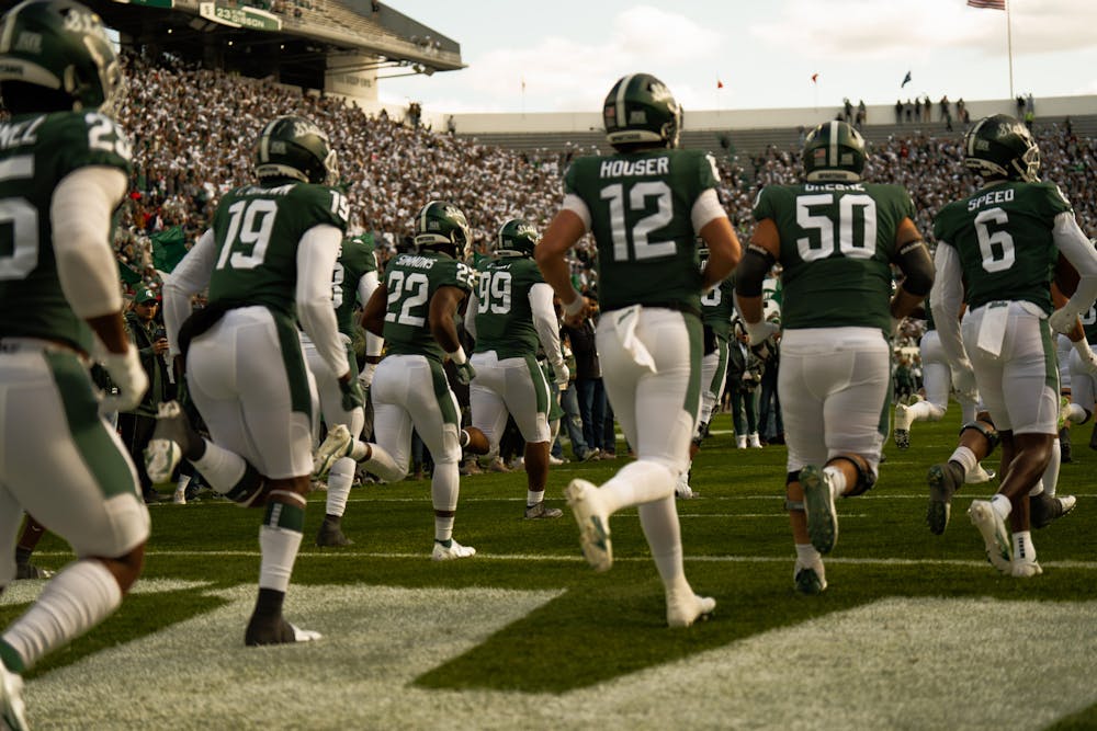 <p>MSU football team entering the stadium. The Spartans took victory over the Badgers 34-28. Held at the Spartan Stadium held on October 15, 2022.</p>