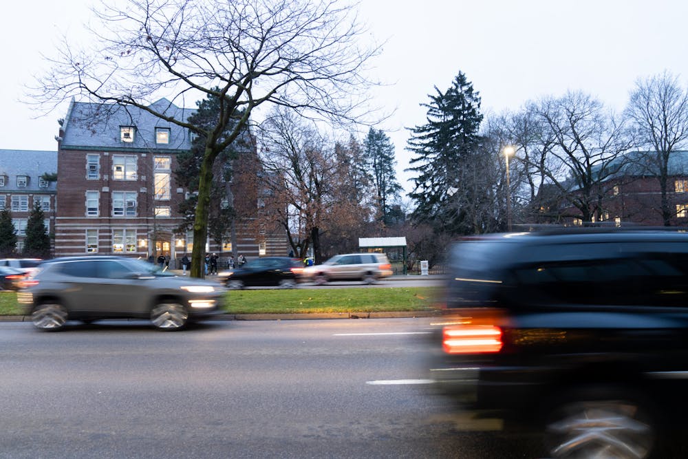<p>Traffic rushes past Grand River Avenue during rush hour on Jan. 19, 2023. </p>