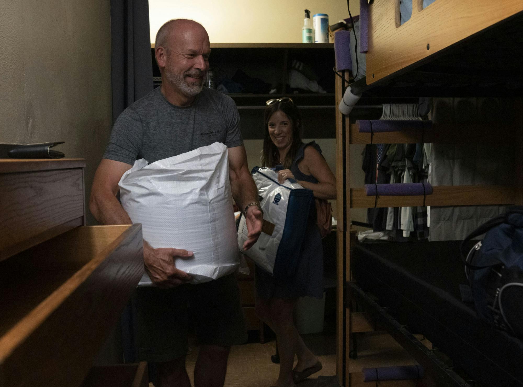 <p>John and Julie Dittmar move in their son, Riley, into Akers Hall during Fall 2022 Move-In on Thursday, Aug. 25, 2022 at Michigan State University.</p>
