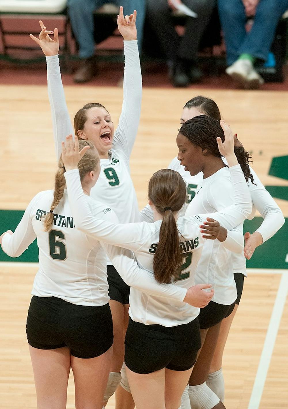 Members of the volleyball team cheer after scoring a point against Wisconsin on Nov. 10, 2012, at Jenison Field House. The Spartans beat the Badgers  by winning scores of 25-19, 25-20, and 25-20, giving the Spartans a fourth consecutive win against conference opponents for the first time since 2003. Natalie Kolb/The State News
